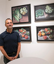 ASL Artist with Vegetable Paintings Thumbnail