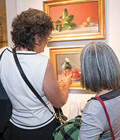 ASL Exhibit Guests Looking at Vegetable Paintings Thumbnail